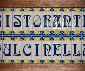 Pulcinella tile sign
