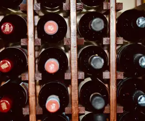 Wine rack filled with red wine