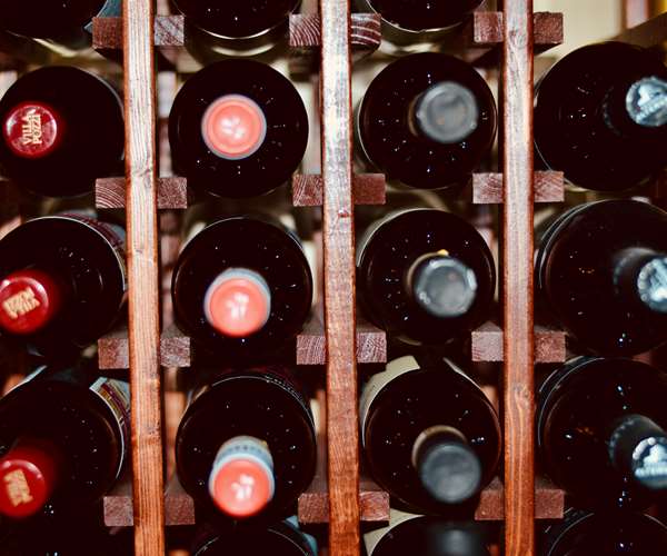 Wine rack filled with red wine